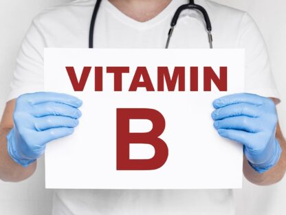 vitamín B the male doctor holding a card with vitamin b text, medical conc